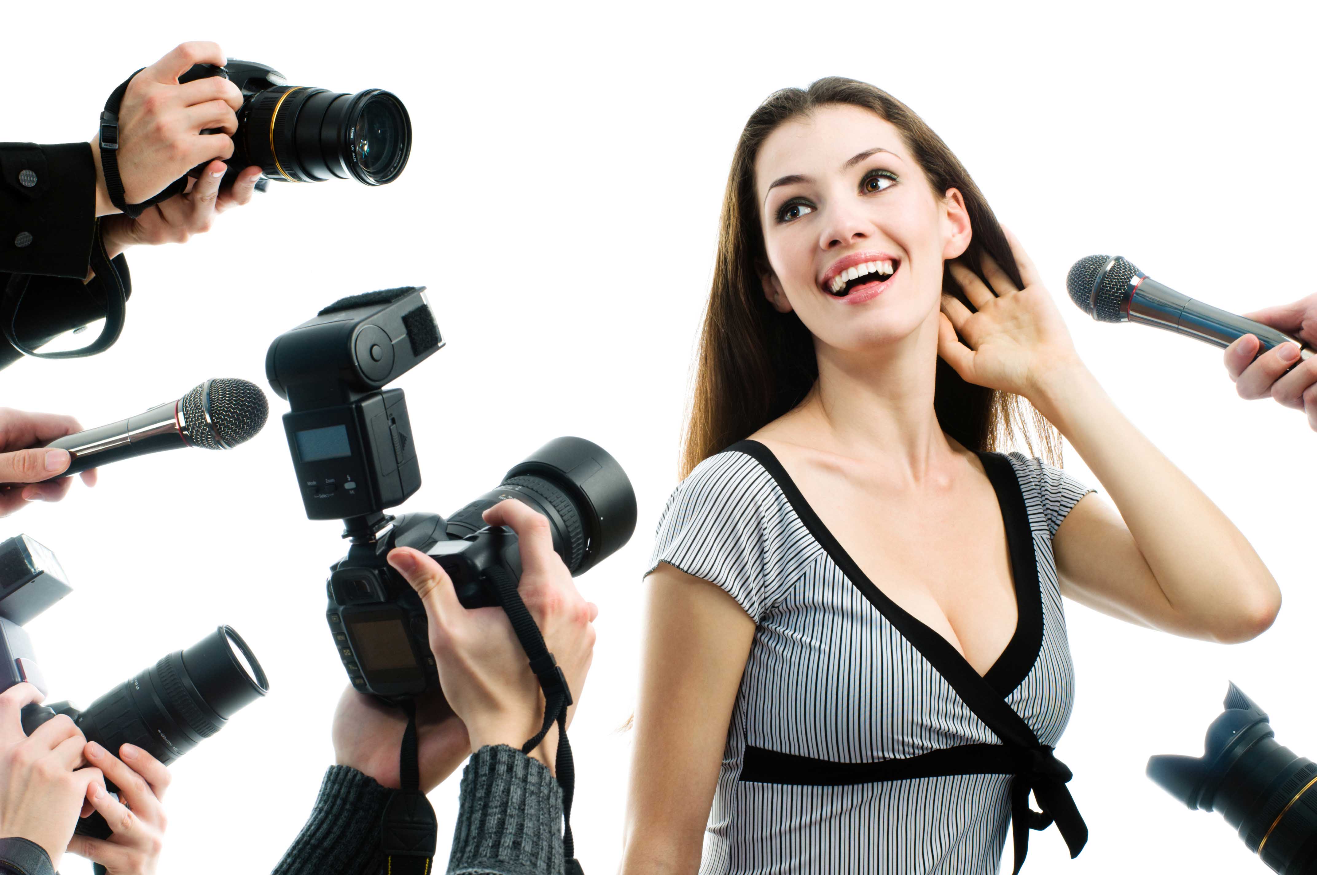 Photographers are taking a picture of a film star Photographers are taking a picture of a film star